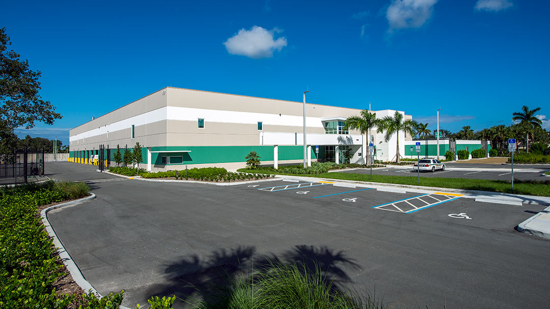 exterior of evidence facility with parking lot in front